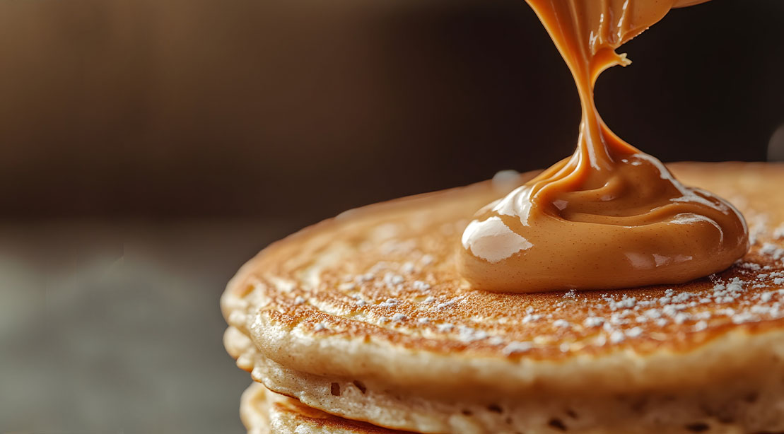 10 Easy Ways to Increase Your Protein Intake With Every Meal and Snack 5 Peanutbutter pancakes with a dolop of peanut butter on top