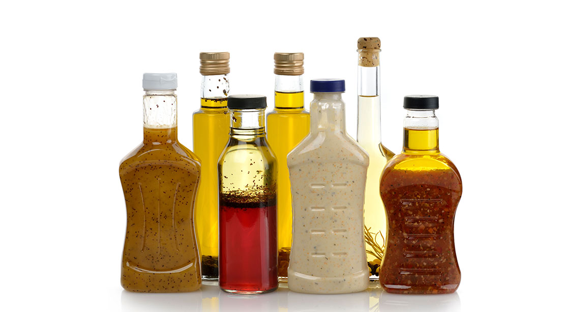 Bottles of salad dressing that contain food additives including emulsifiers to prolong their shelf life