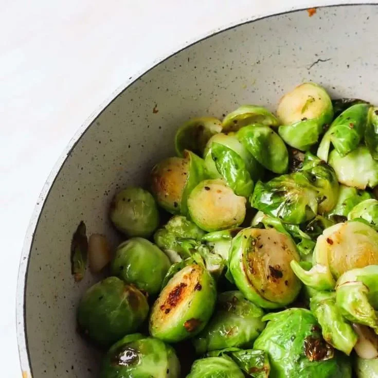 Variety of high-protein vegetables including broccoli, spinach, and peas.